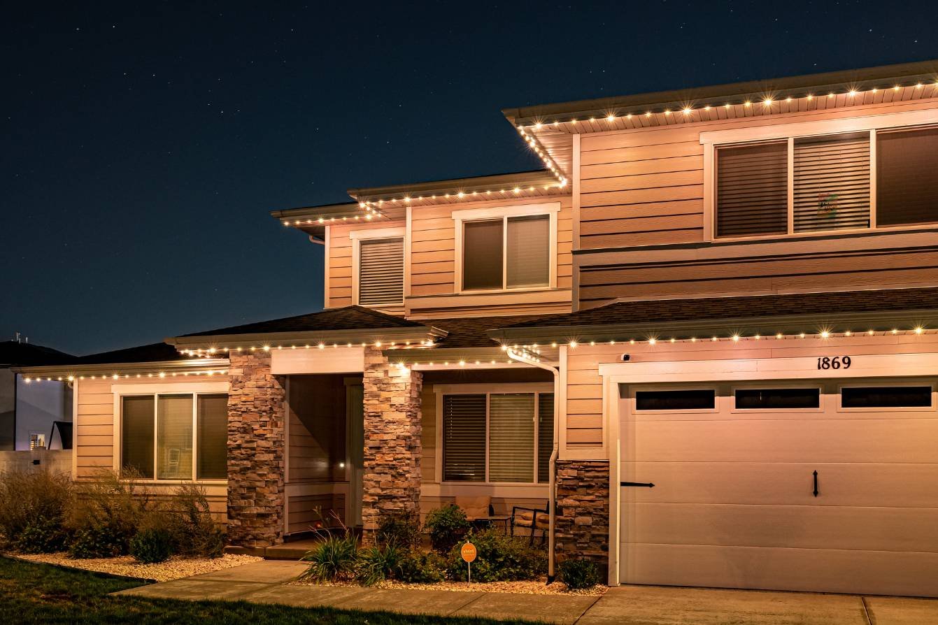 Home with no peaks and a flat roofline with bright Trimlight LED accent lighting
