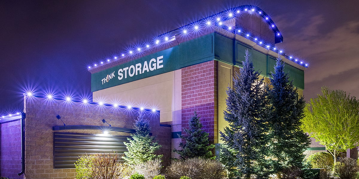 blue accent lighting on commercial storage building