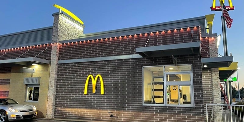 Exterior of McDonalds restaurant with Trimlight downlights glowing
