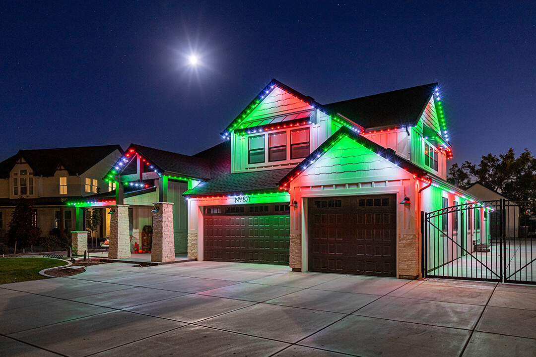 Bright green, red, white lighting on a modern home
