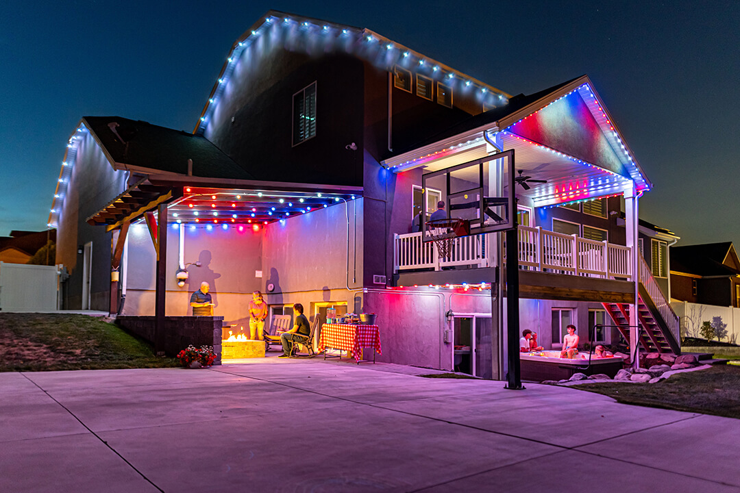 House and patios with multi-color custom lighting and Globe Lights