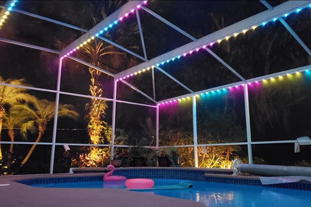 Neon LED pool cage at night