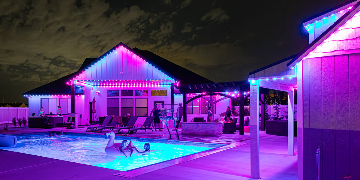 Bright neon pink and blue pool party LED setup