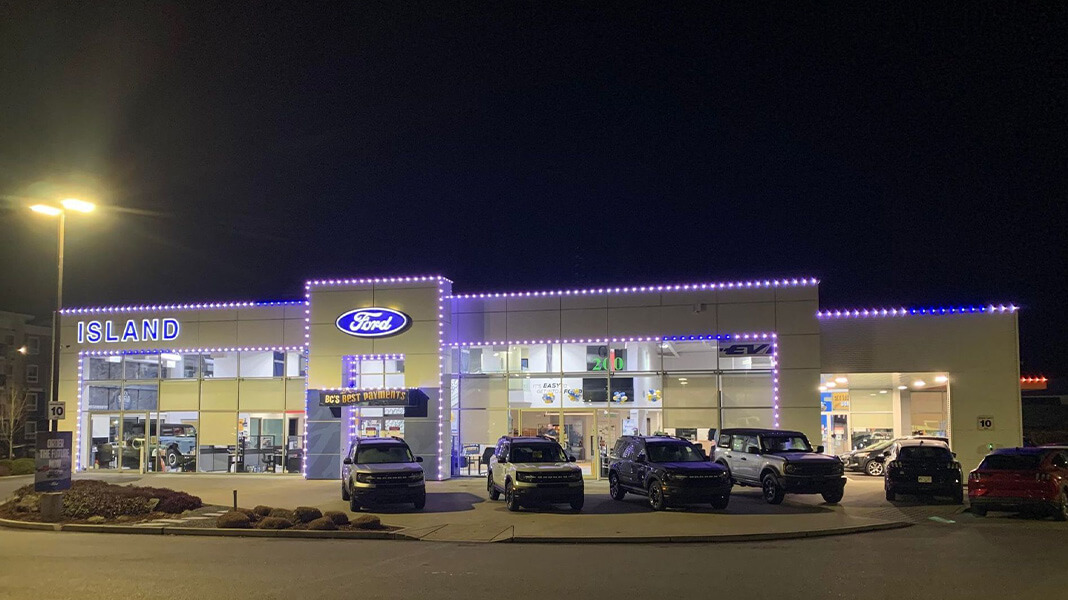 Ford car dealership with brand themed colored LED trim