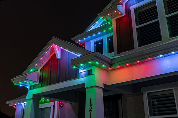 Multi-colored trim lighting on a house at night